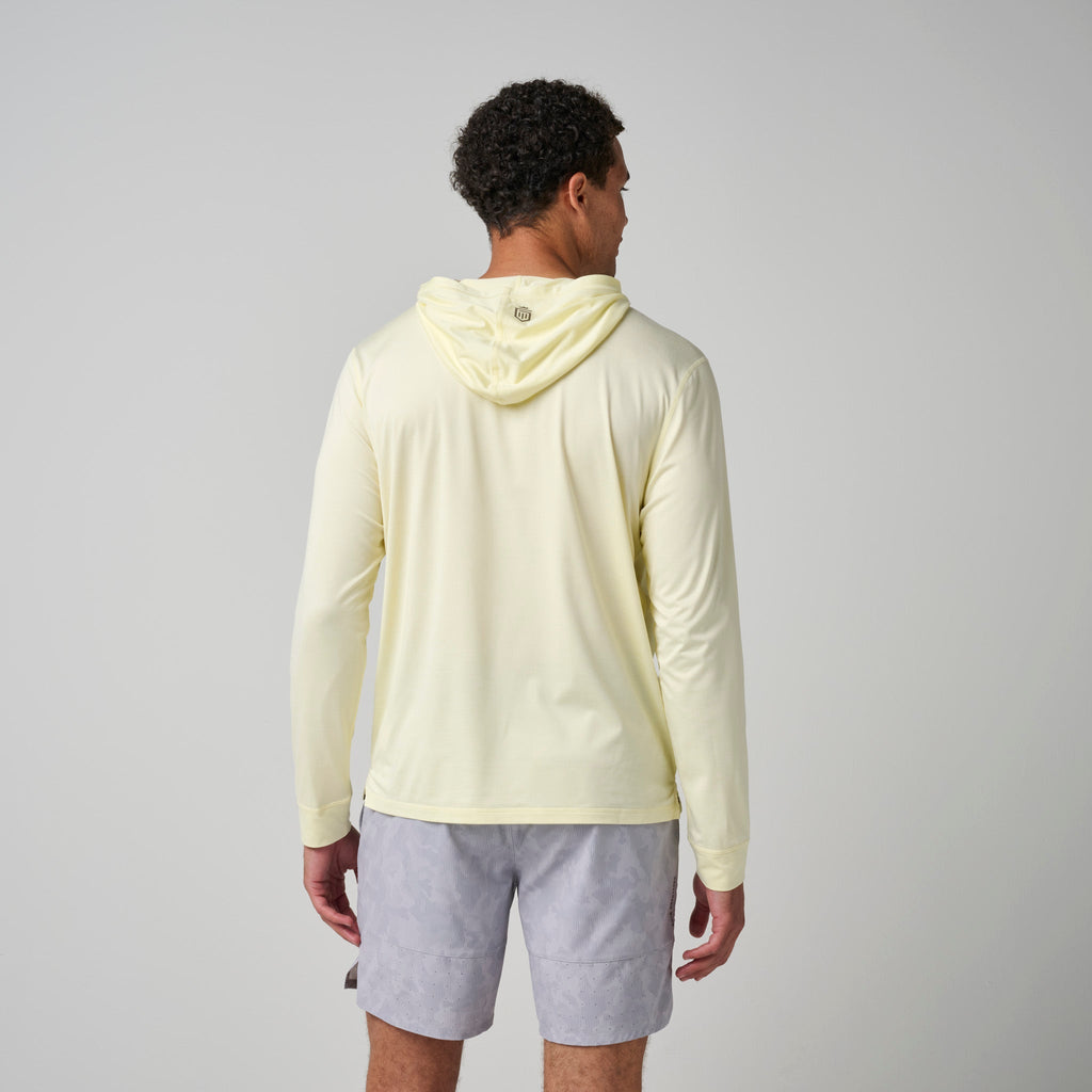 Light yellow hoodie on model from back, hood down and long sleeves