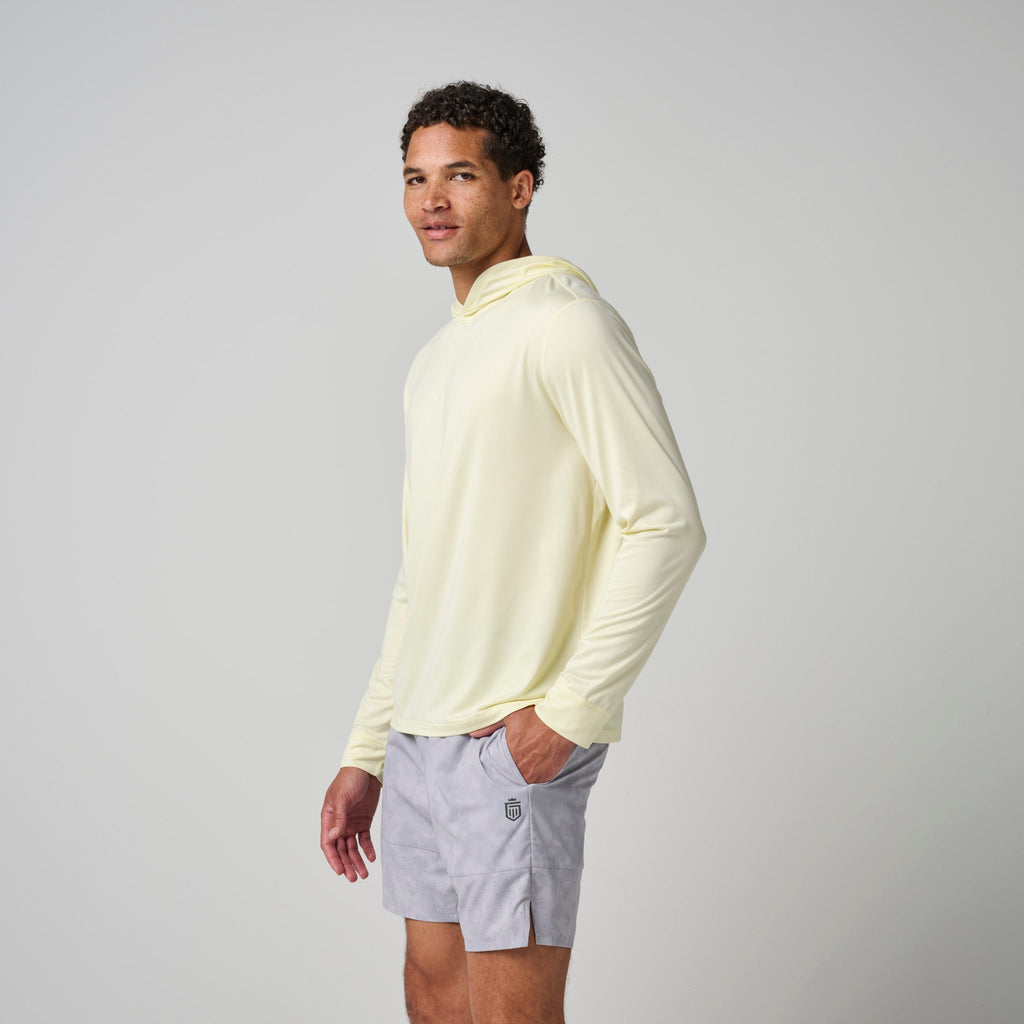 Light yellow pullover hoodie in side profile, long sleeves and hood