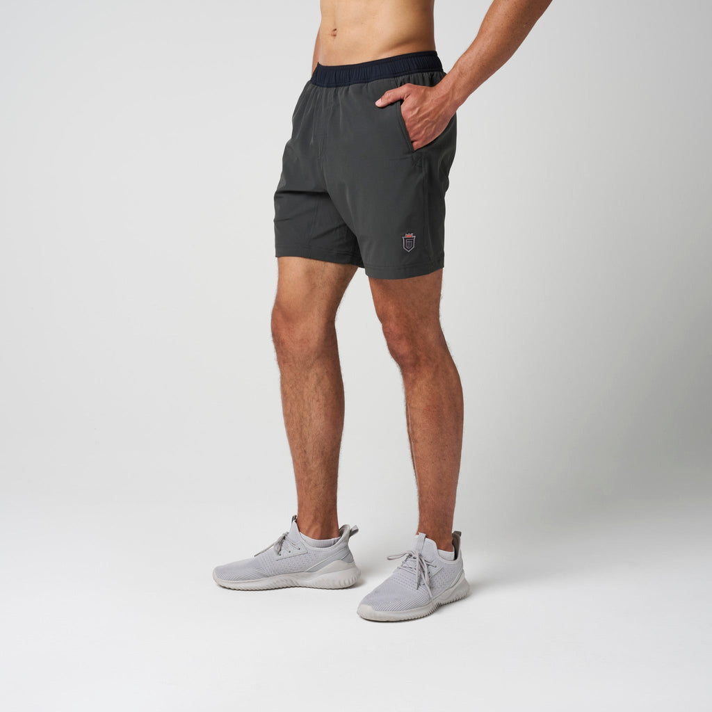 Dark training shorts with elastic waistband and side hand pockets