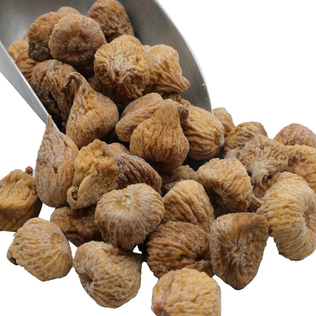 Golden organic dried figs in bowl, wrinkled pieces