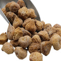 Golden organic dried figs in bowl, wrinkled pieces