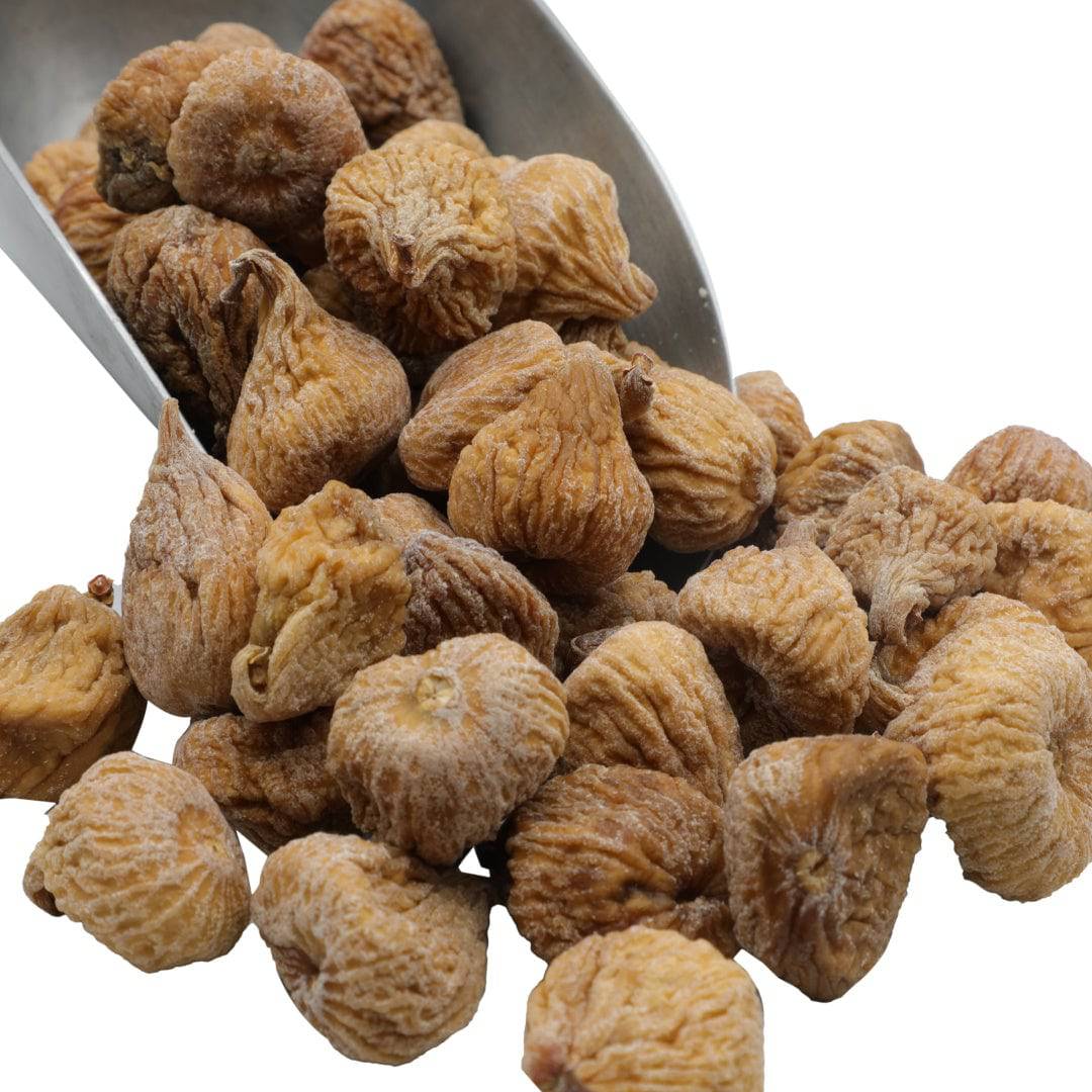 Golden organic dried figs in bowl, wrinkled pieces