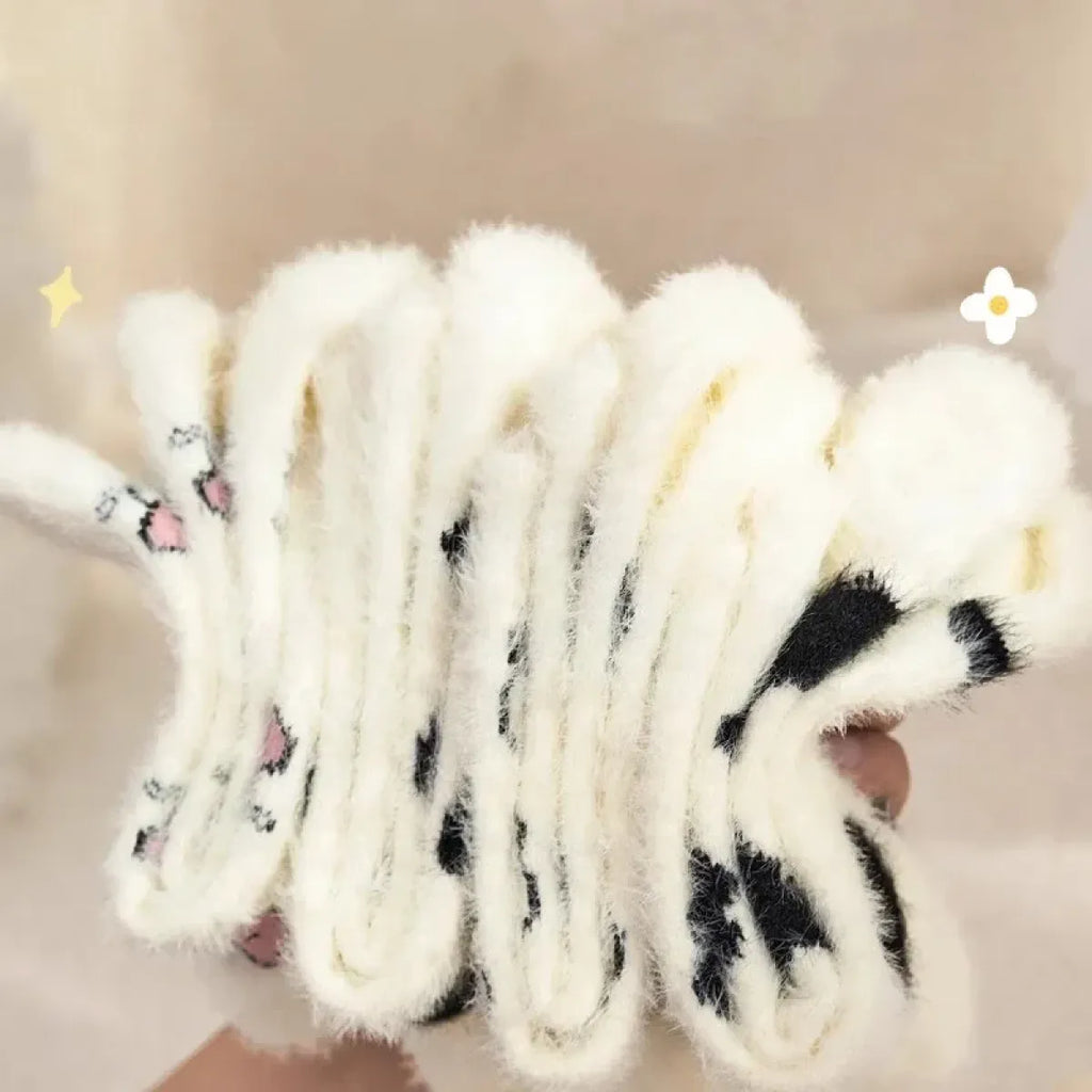 Women’s cow mink velvet socks, plush white with black cow patches and striped knit look