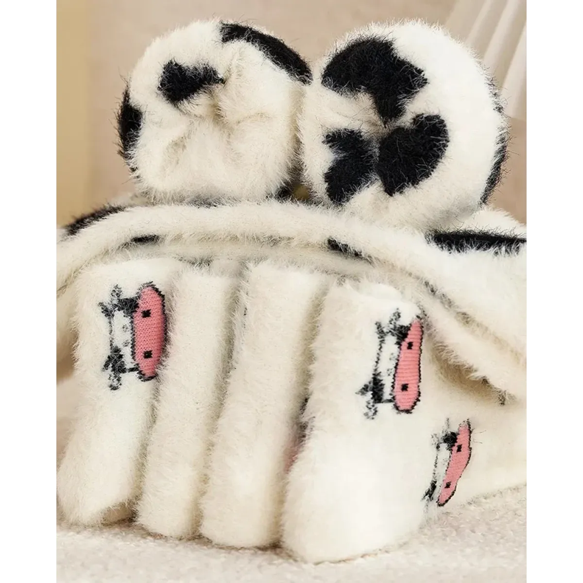 Women’s cow mink velvet socks, plush white with black heart-like cow patches and pink accents
