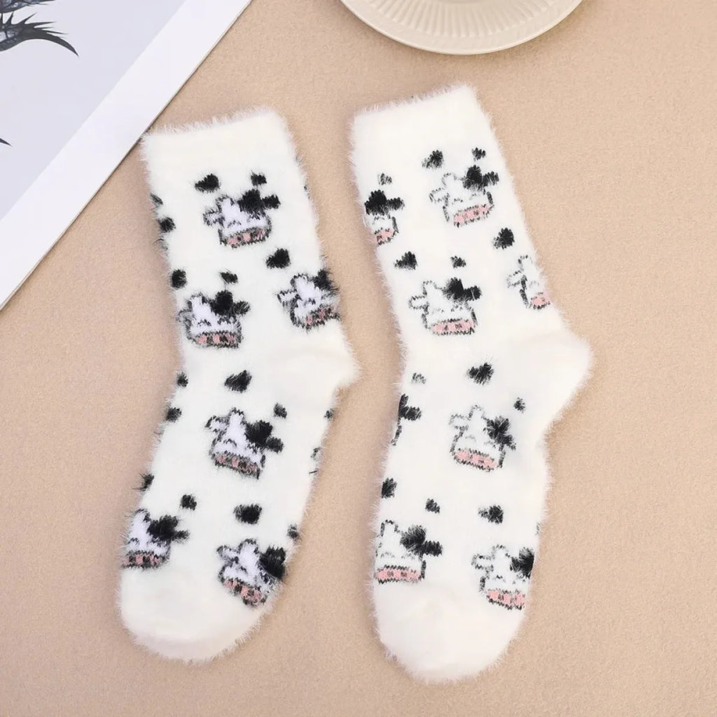 Women’s cow mink velvet socks, fluffy white with repeated black cow faces and pink mouths