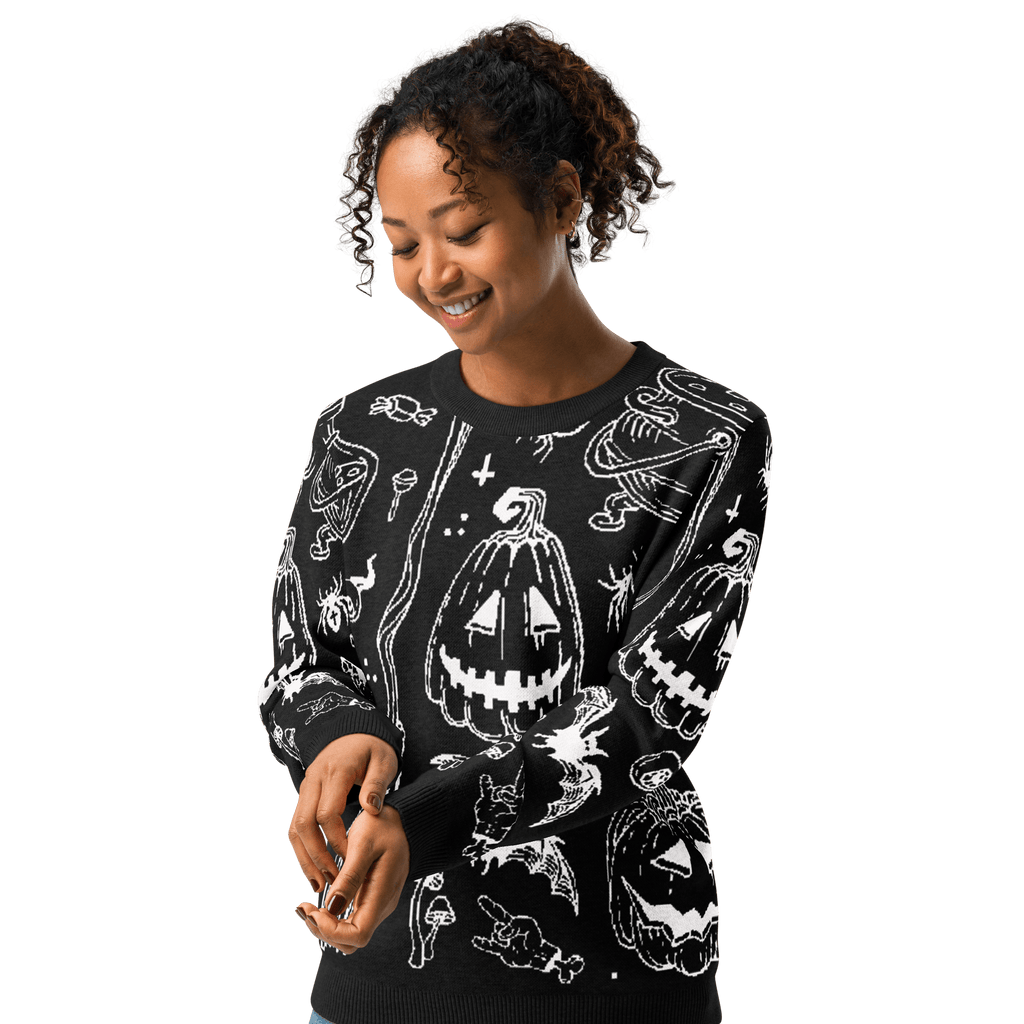 Black crewneck knit sweater with white Halloween-themed icons and long sleeves