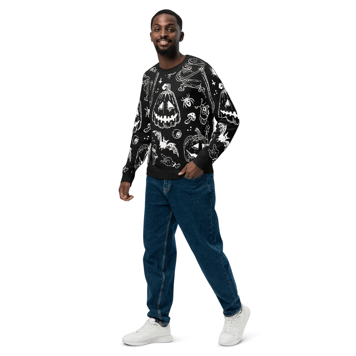 Black crewneck Halloween graphic knit sweater with long sleeves worn with jeans