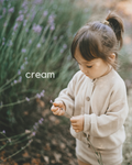 Cream knit cardigan with button front and long sleeves