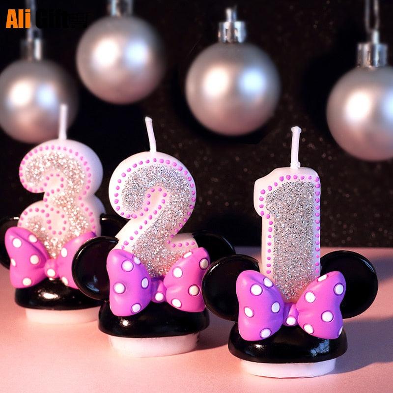 Birthday numeral cake candle '3' with silver glitter, pink bow, and black ear base