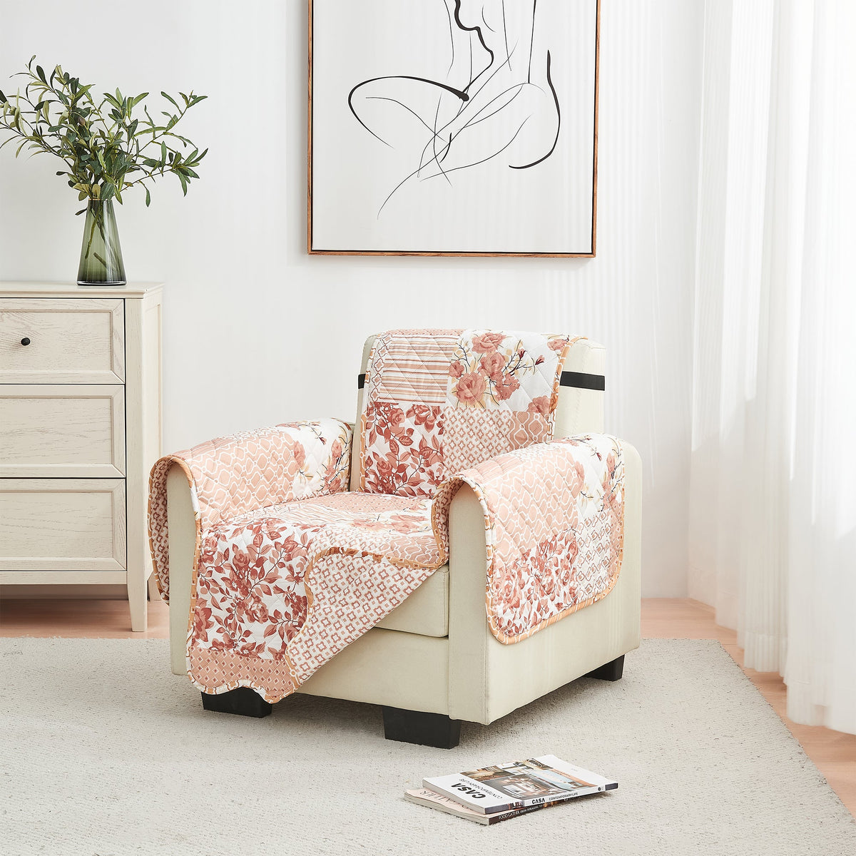Reversible armchair protector covering a beige recliner with peach floral patchwork