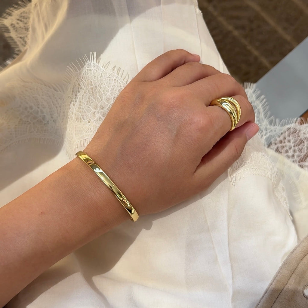 Gold-tone cuff bracelet set with smooth and ridged bands.