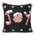 Black throw pillow cover with red/white peppermint swirls, candy canes, and stars