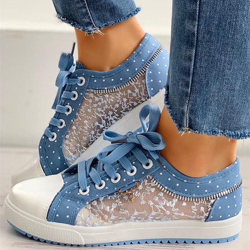 Women’s blue lace-up platform sneakers with white dotted panels and bow-tied laces