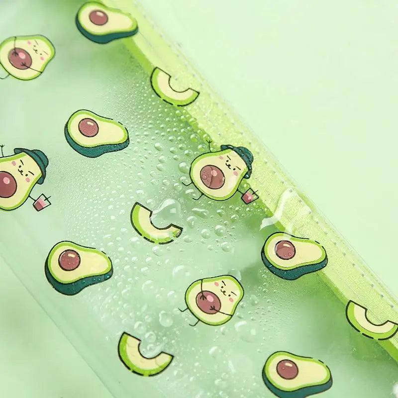Clear avocado-print pencil pouch corner with fruit faces and textured dots.
