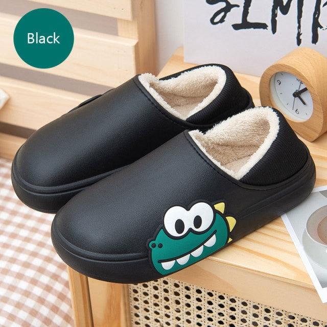 Black slip-on slippers with fuzzy lining and crocodile-style cartoon graphic