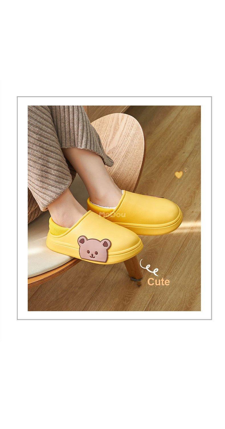 Yellow slip-on slippers with bear applique and plush lining