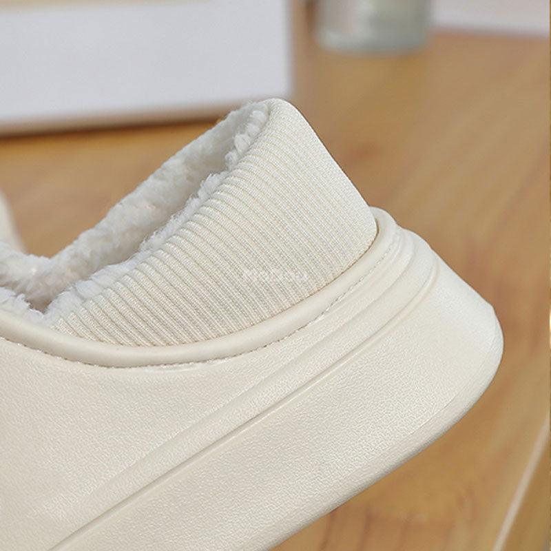 White slip-on slippers with ribbed knit collar, fuzzy sherpa lining, wrapped cushioned heel