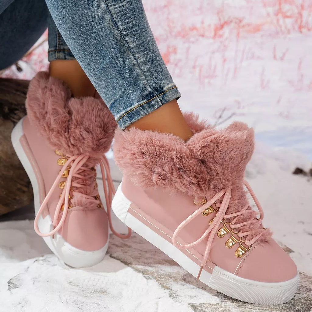 Pink lace-up ankle boots with fuzzy trim and gold eyelets