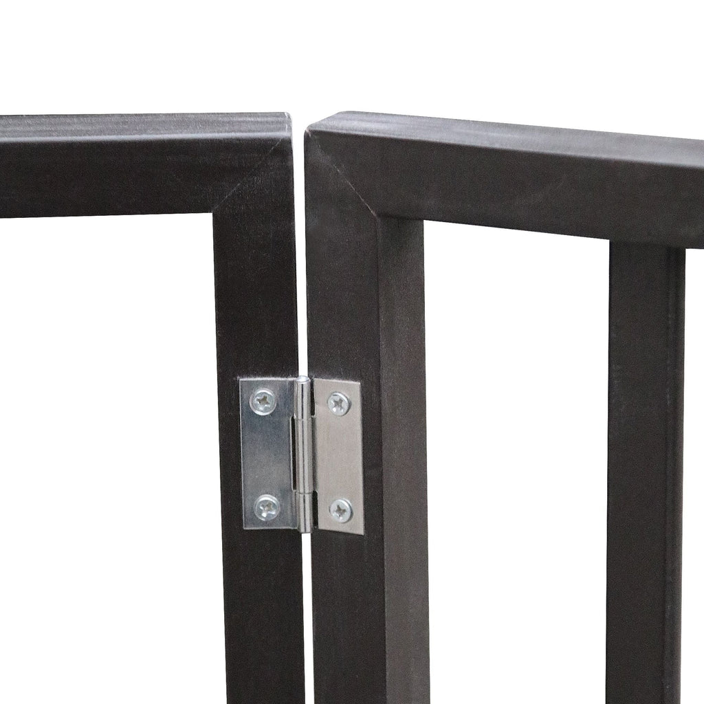 Close-up of pet gate hinge hardware with screws on dark frame.