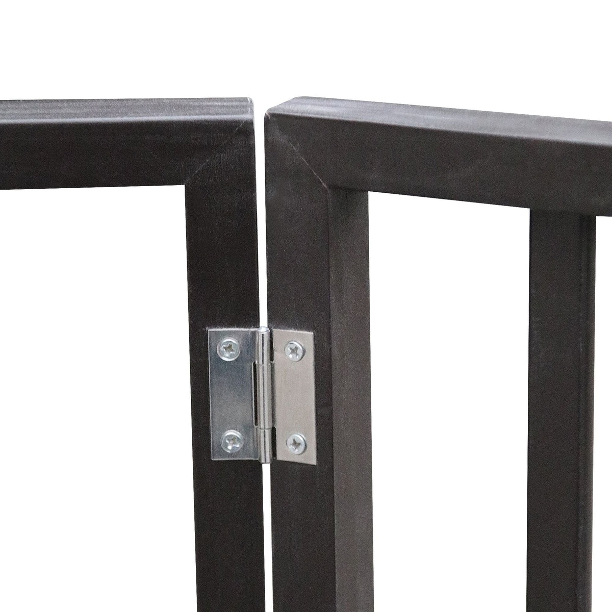 Close-up of pet gate hinge hardware with screws on dark frame.