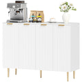 White sideboard buffet cabinet with striped doors and tall gold metal legs