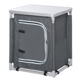 Grey aluminum camping kitchen station with two-shelf cabinet and foldable table