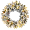 24-inch snow-flocked Christmas wreath with warm white LED lights, pine cones and berries