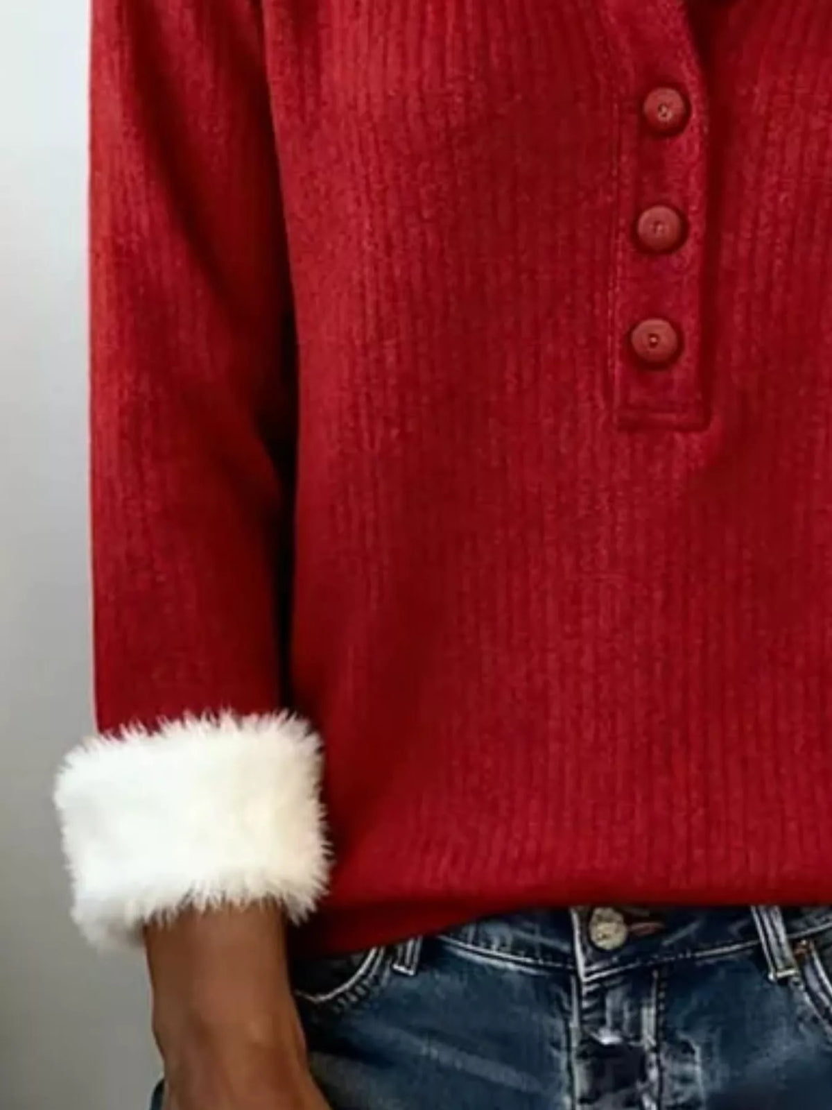 Red knit henley sweater with white faux fur cuff detail and button placket