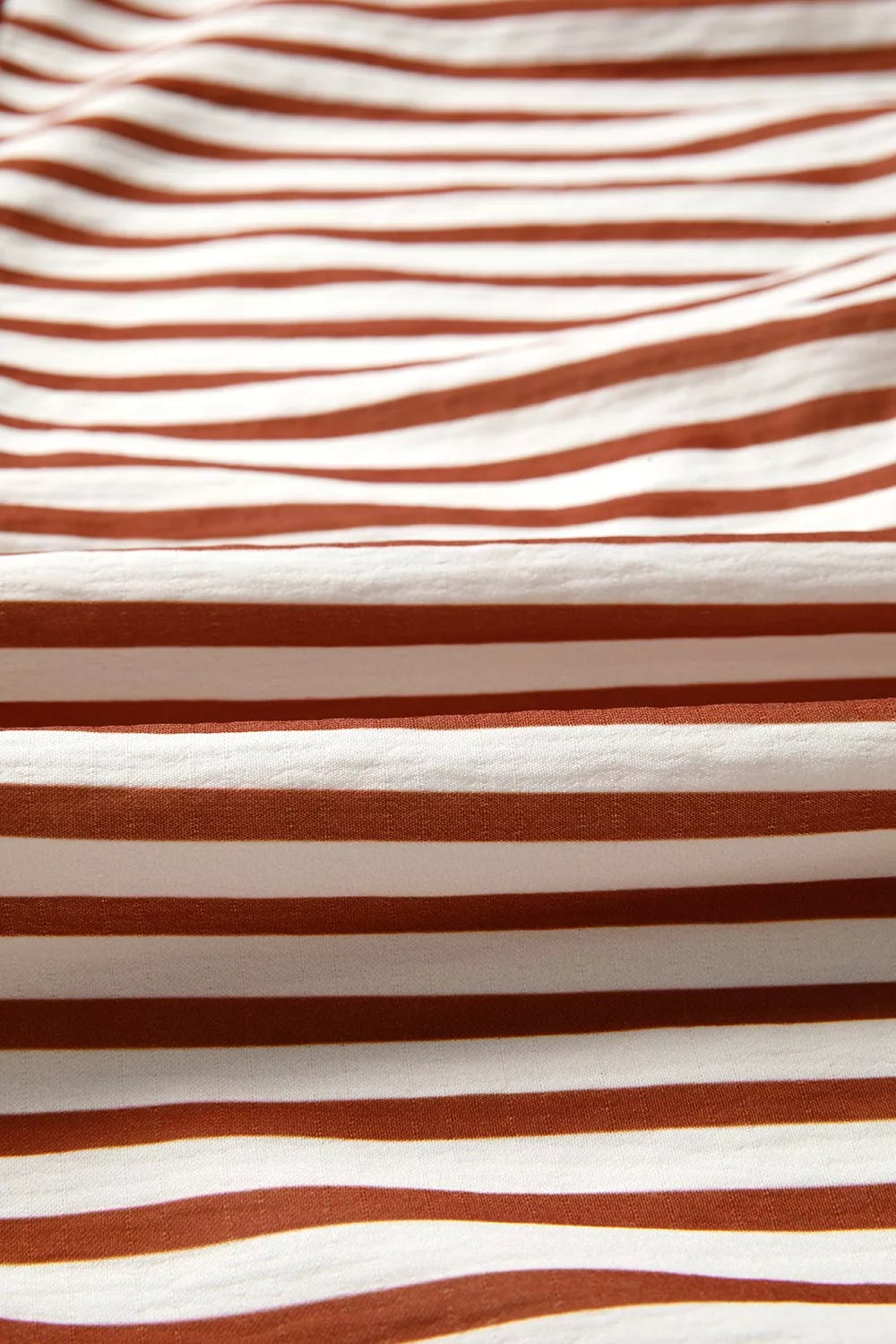 Brown-and-white striped blouse fabric with horizontal candy-cane style lines