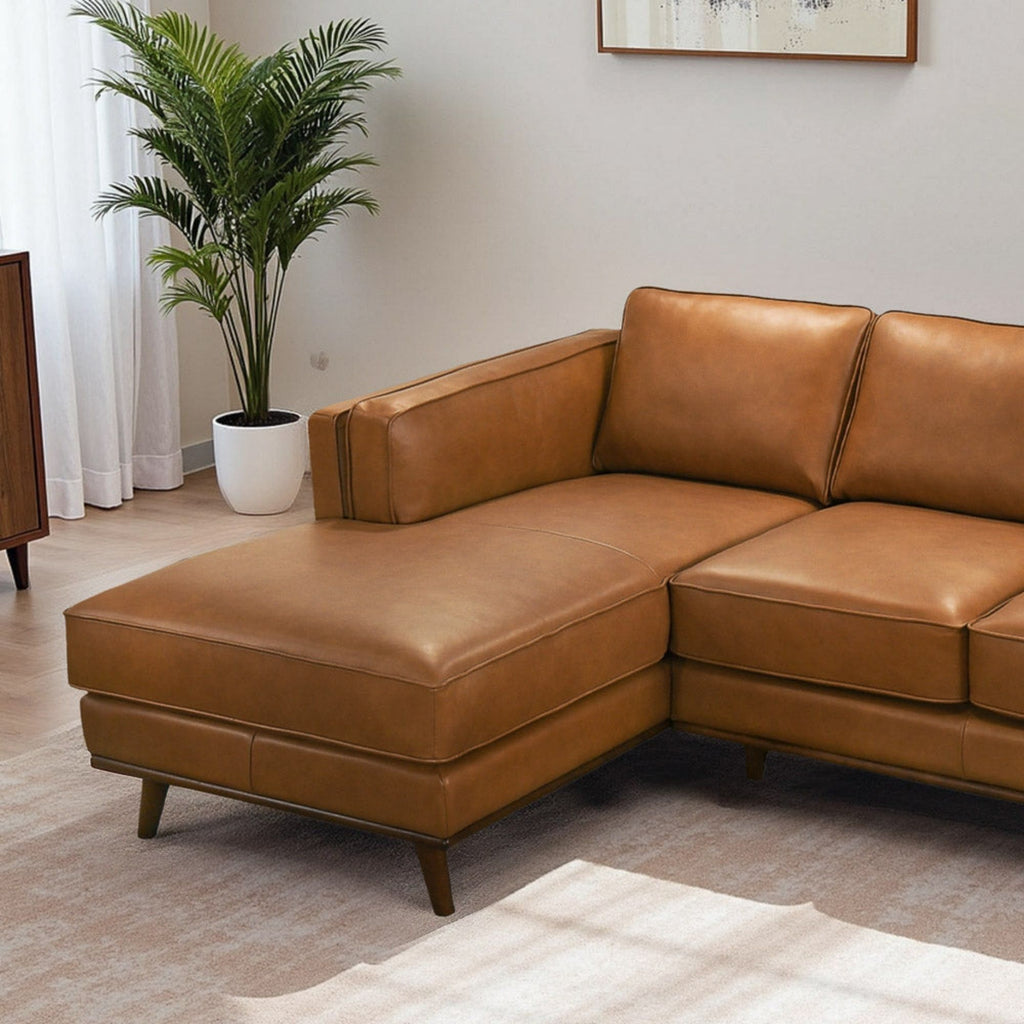 Light brown sectional sofa with chaise seat and back cushions, clean-lined boxy design