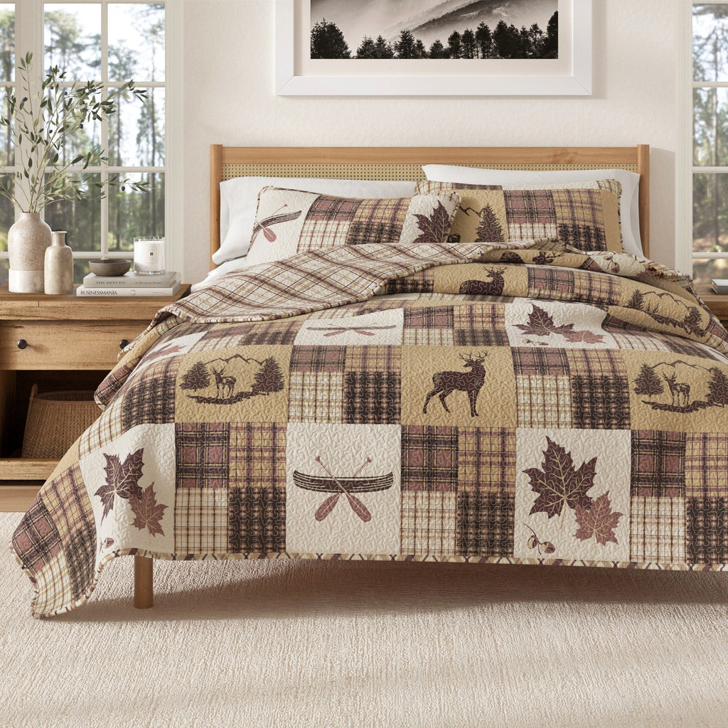 Quilt set with patchwork plaid squares and deer, turkey, and leaf motifs