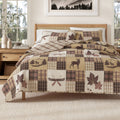 Quilt set with patchwork plaid squares and deer, turkey, and leaf motifs