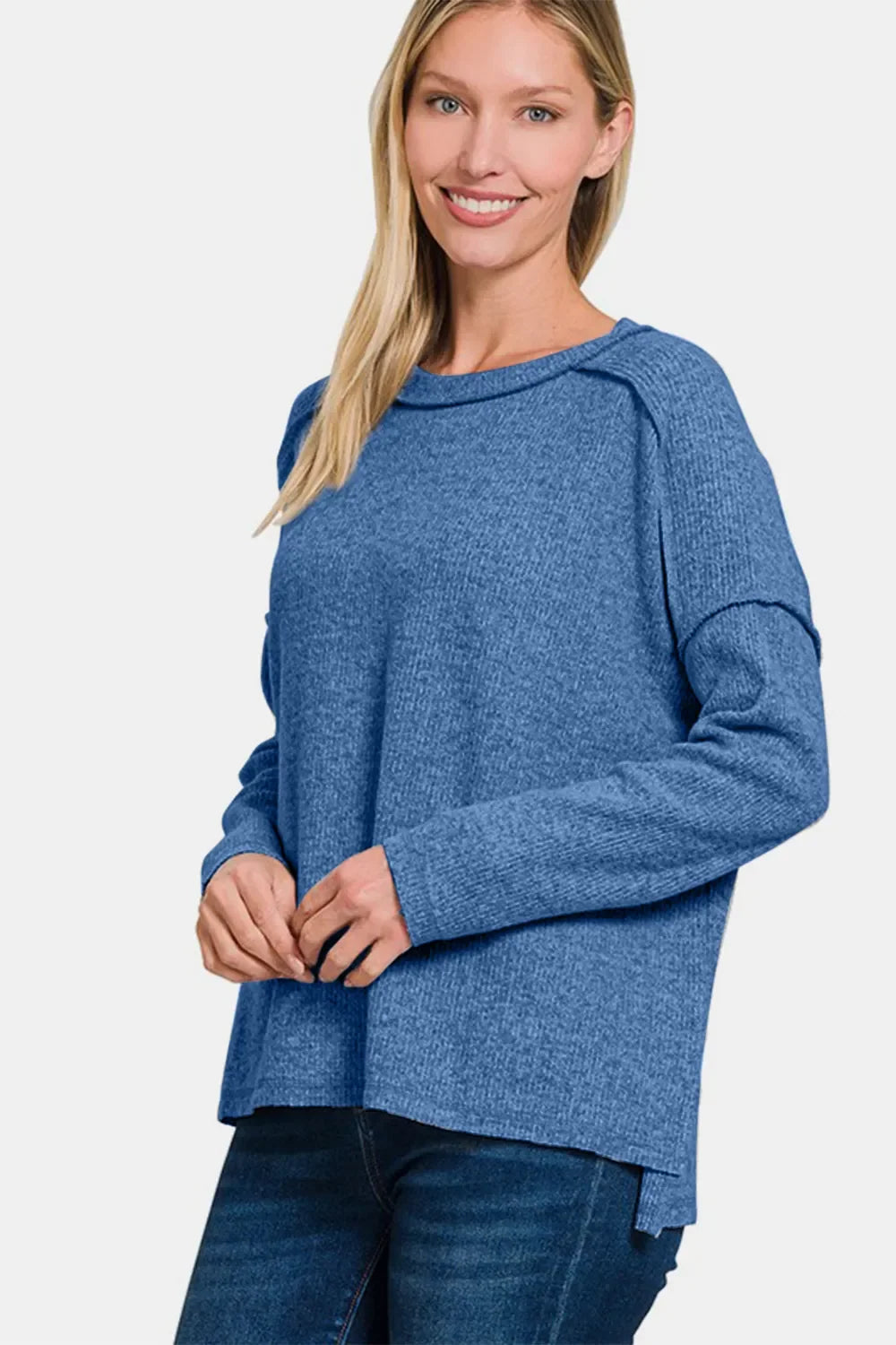 Women's navy-blue brushed round-neck sweater with exposed seams and curved hem