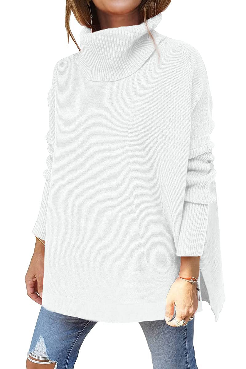 White ribbed knit turtleneck tunic sweater, batwing sleeves, side slit hem