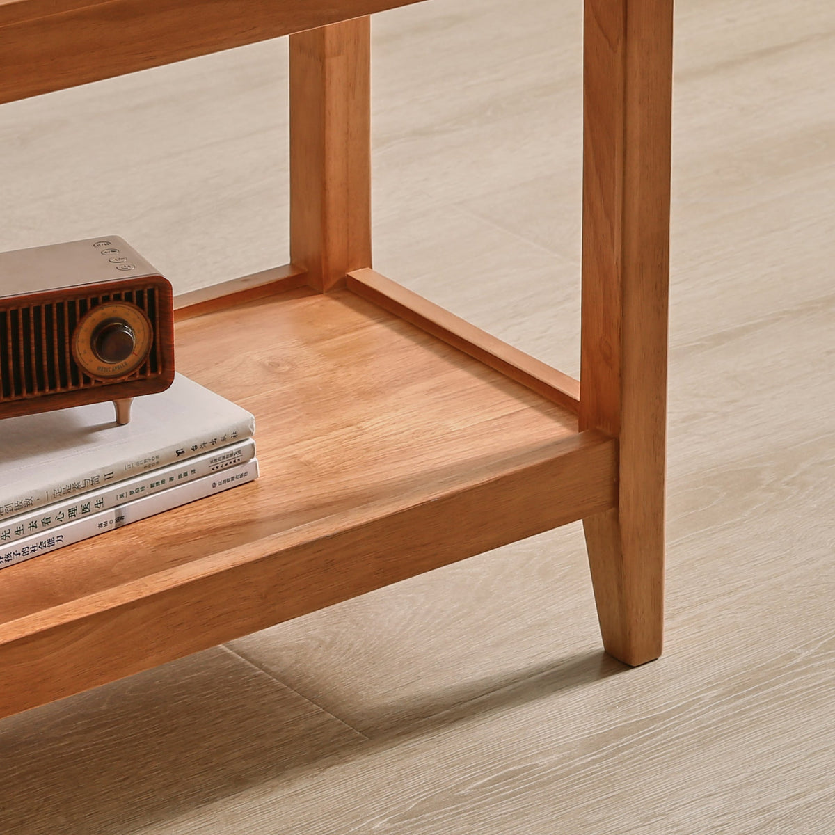 Wooden side table detail showing the lower shelf and sturdy legs