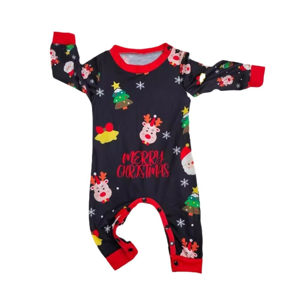 Baby Christmas footed pajama in dark fabric with red trim and colorful snowman graphics