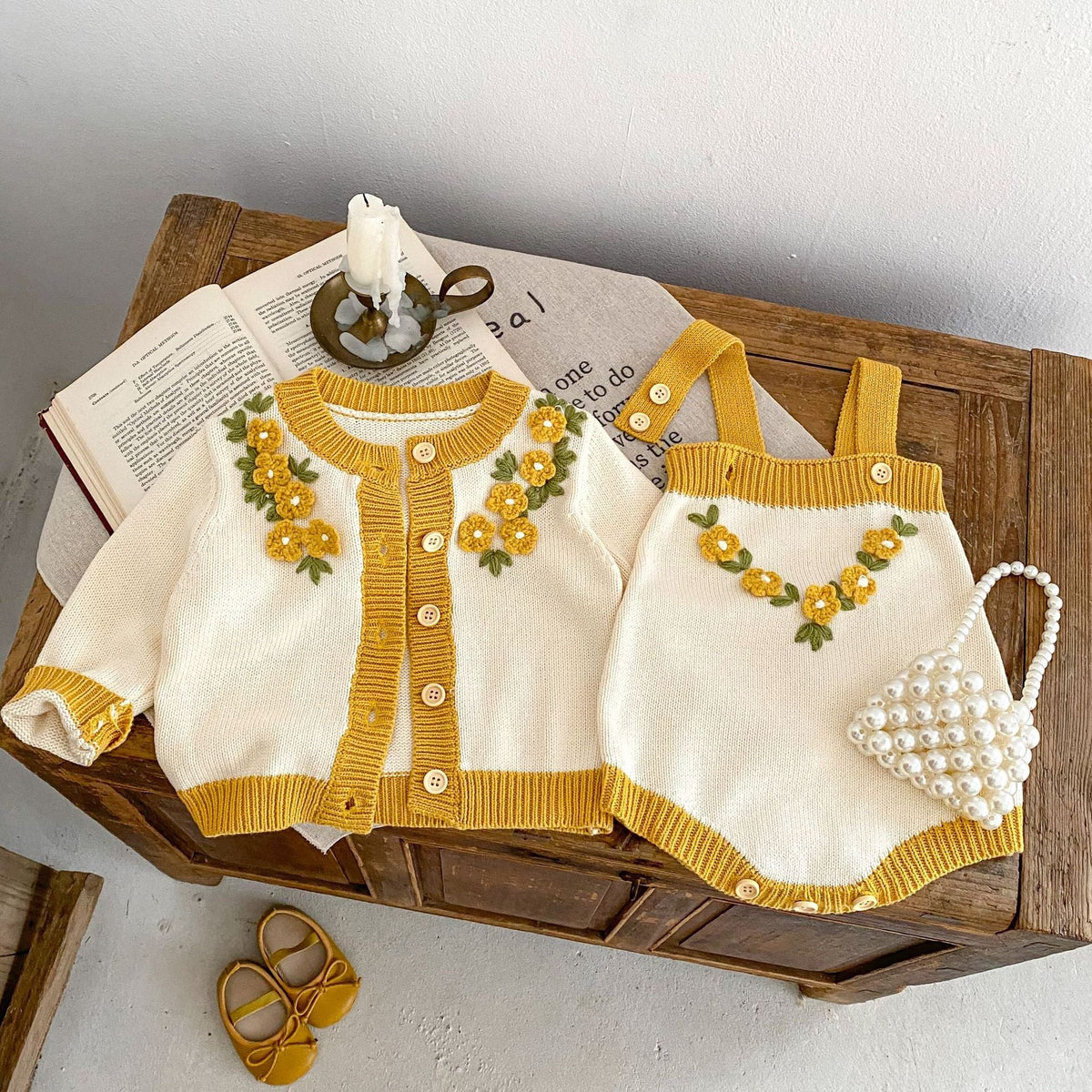 Cream baby coat with mustard trim, button front, floral applique, heart detail