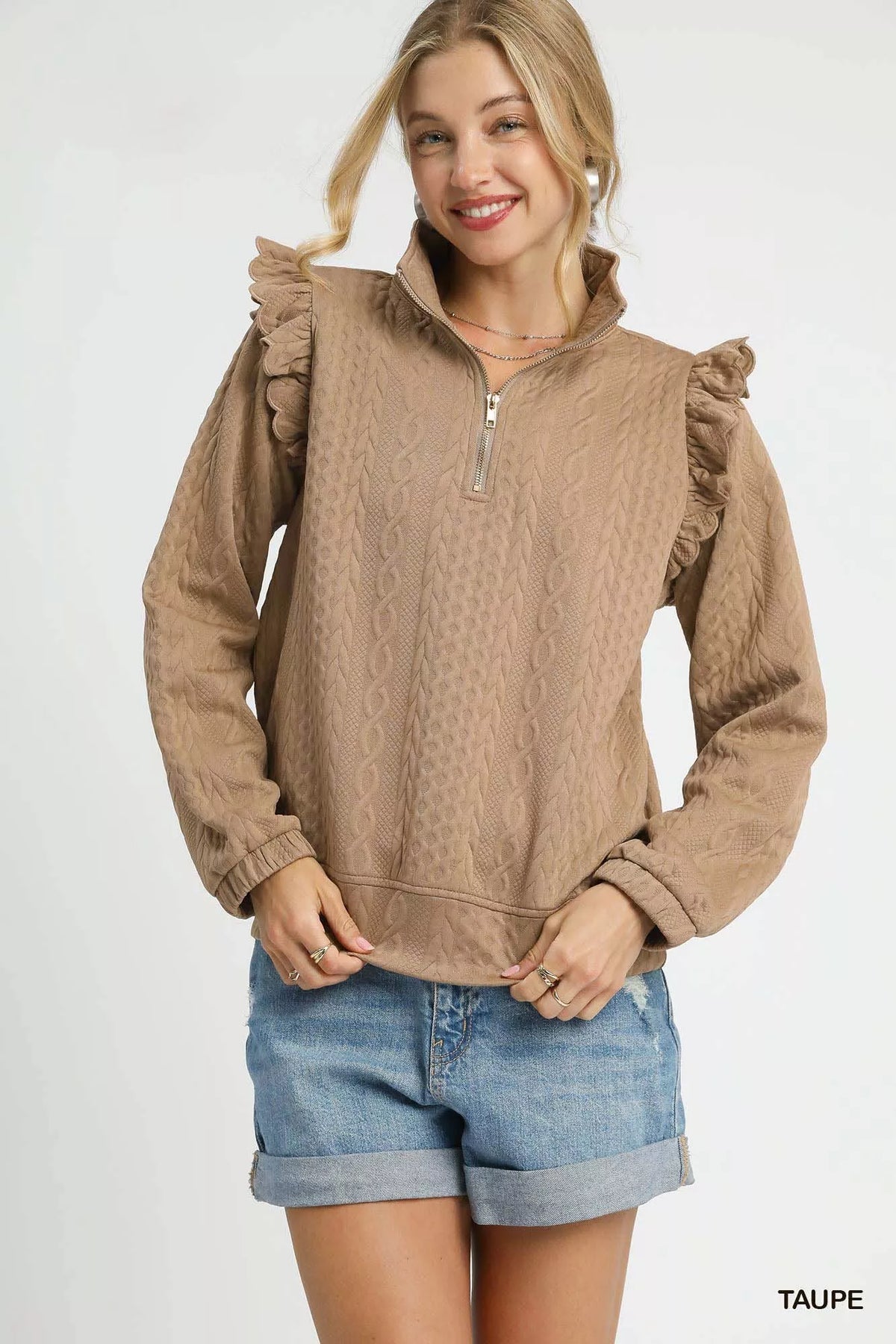 Taupe textured cable knit pullover with ruffle shoulders and half-zip front