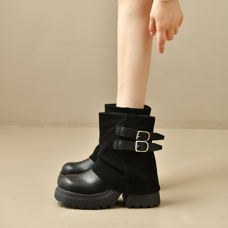Black platform combat ankle boots with two buckled straps and thick lug sole.