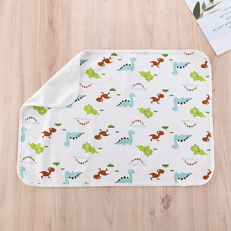 Washable child protection pad, white with colorful dinosaur print and folded side border