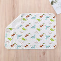 Washable child protection pad, white with colorful dinosaur print and folded side border