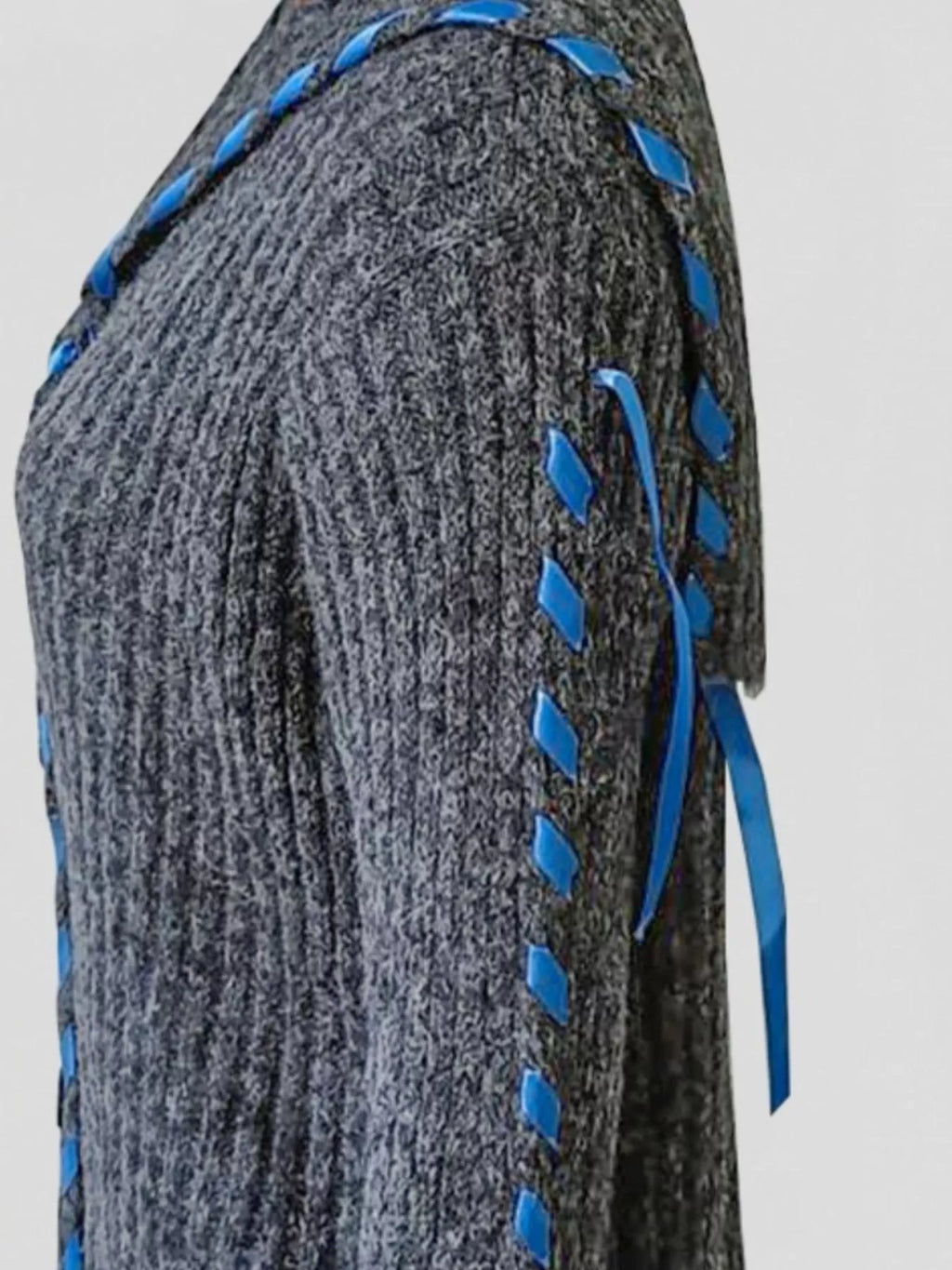 Gray ribbed knit cardigan with blue ribbon-like tie trim along sleeve and side