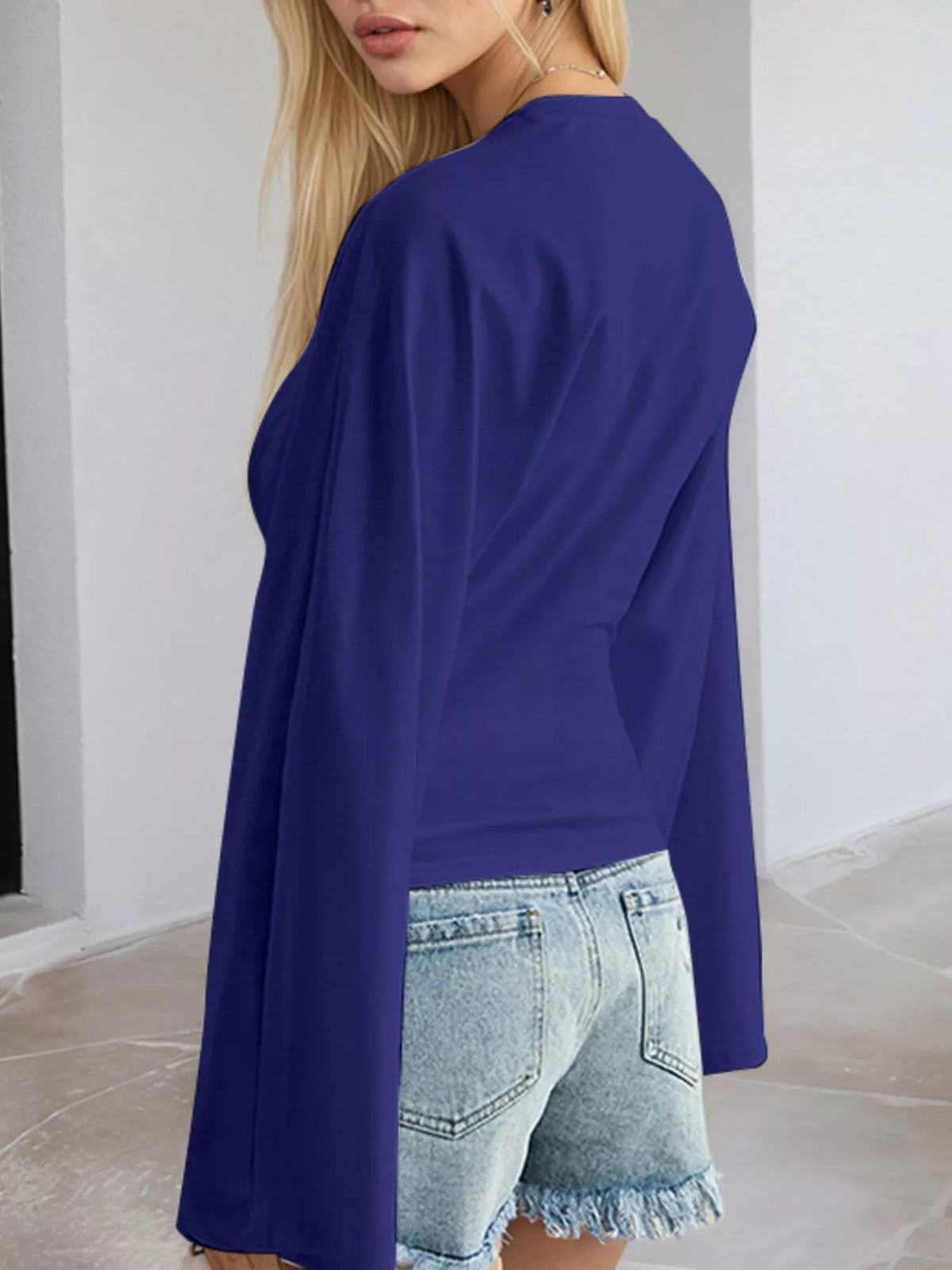 Plus size fitted long-sleeve T-shirt in royal blue, side view, crew neck and wide sleeves