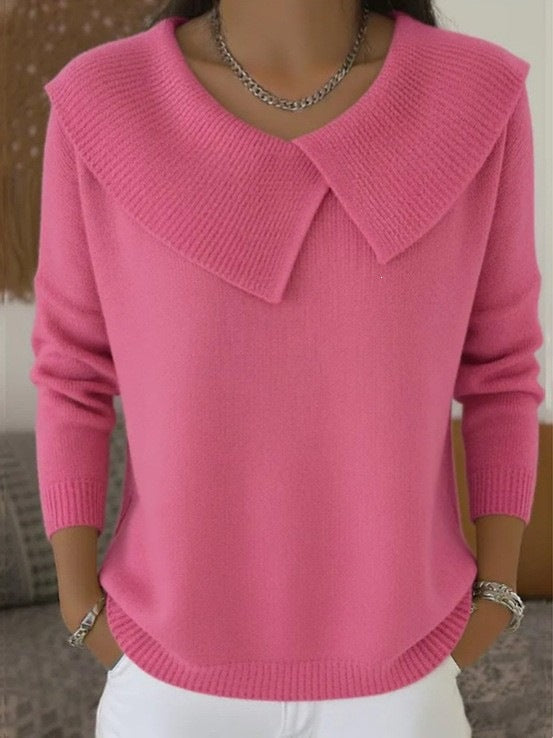 Women's pink oversized knit sweater with wide collared V-neck, long sleeves