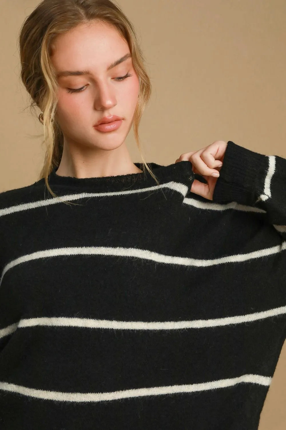 Black striped wool-blend sweater with crew neck and cream horizontal stripes