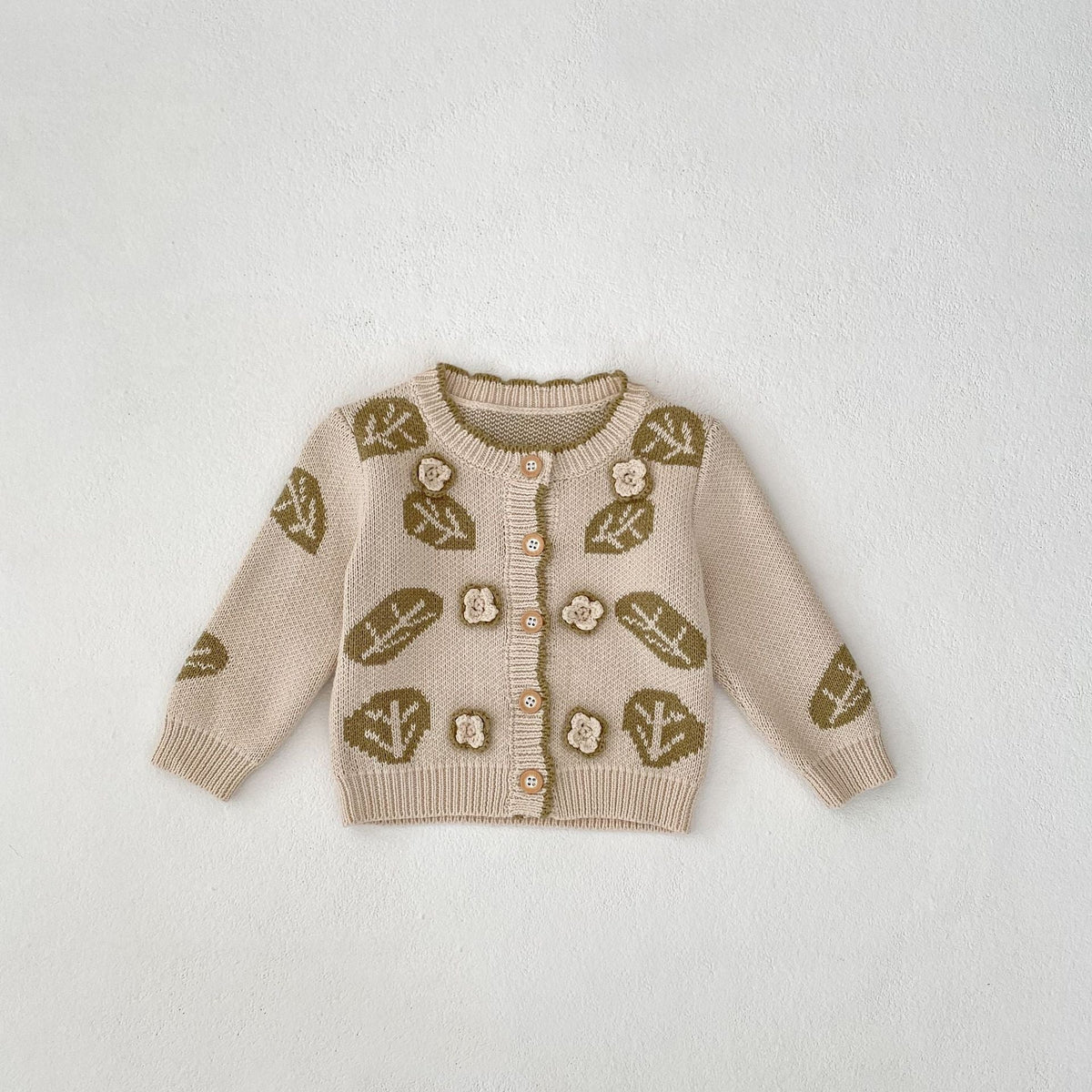 Children's cream leaf-jacquard cardigan sweater with white ruffled yoke and button placket