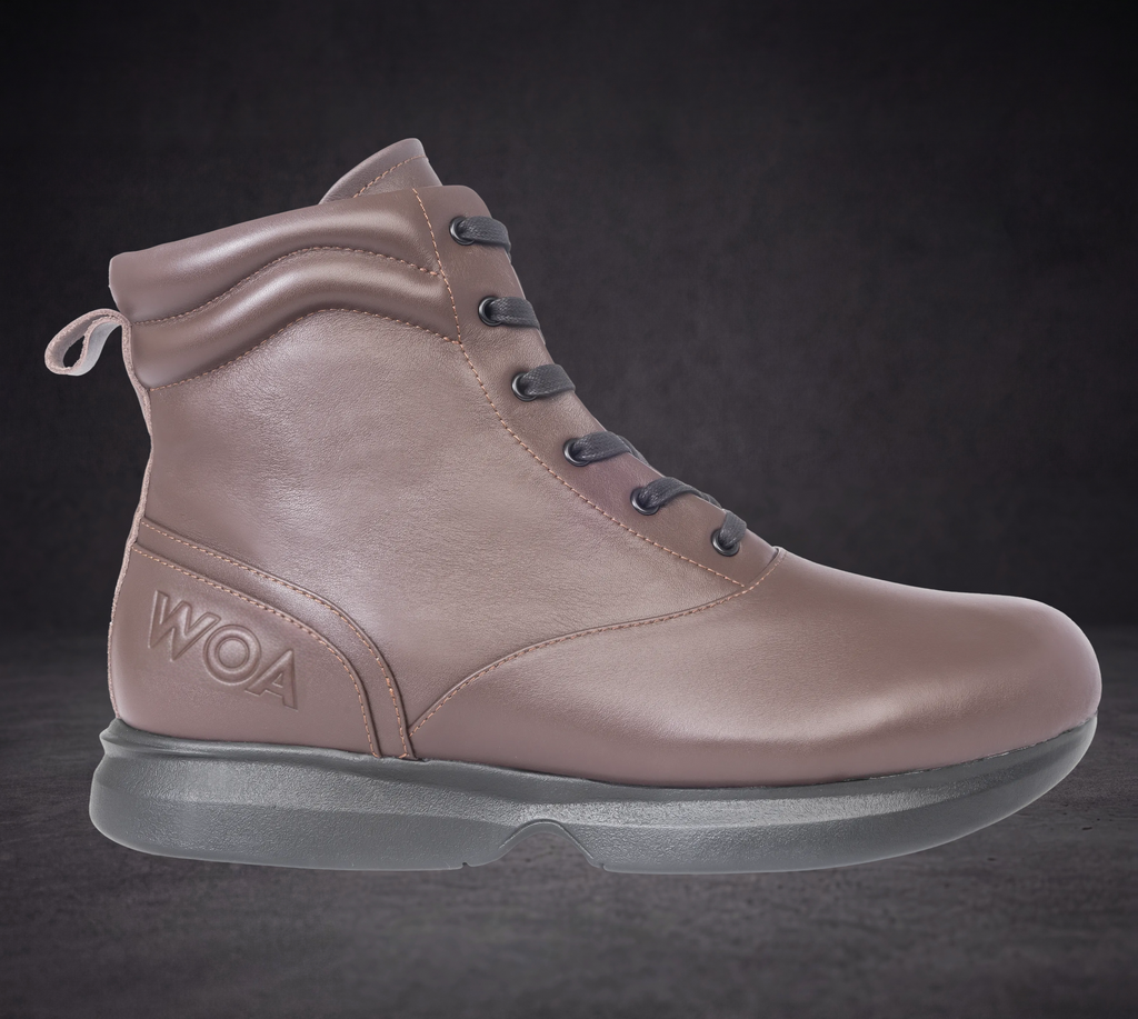 Single WOA taupe ankle boot with dark laces, WOA logo, and thick grippy sole