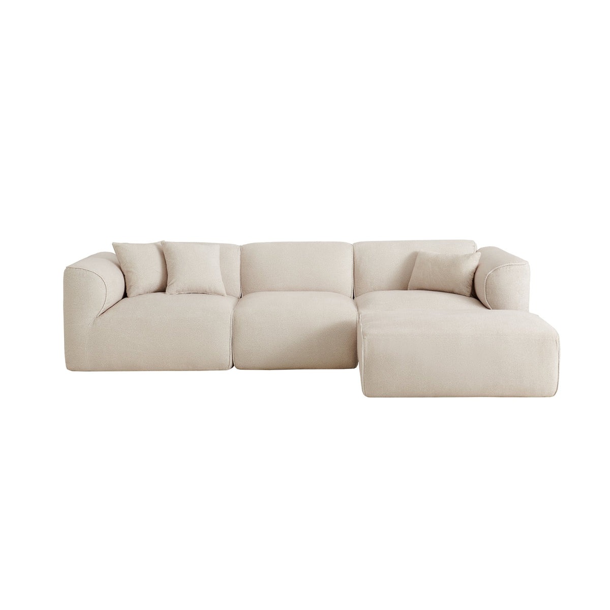 Light beige sectional sofa with right-facing ottoman and square seat cushions
