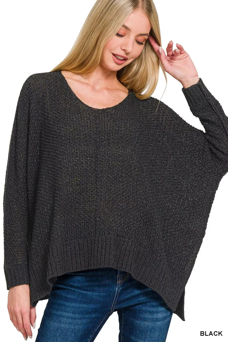Black dolman-sleeve V-neck knit sweater, relaxed drape and ribbed cuffs