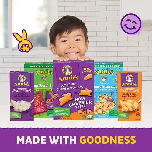 Assorted snack boxes featuring organic cheddar bunnies, with child smiling.